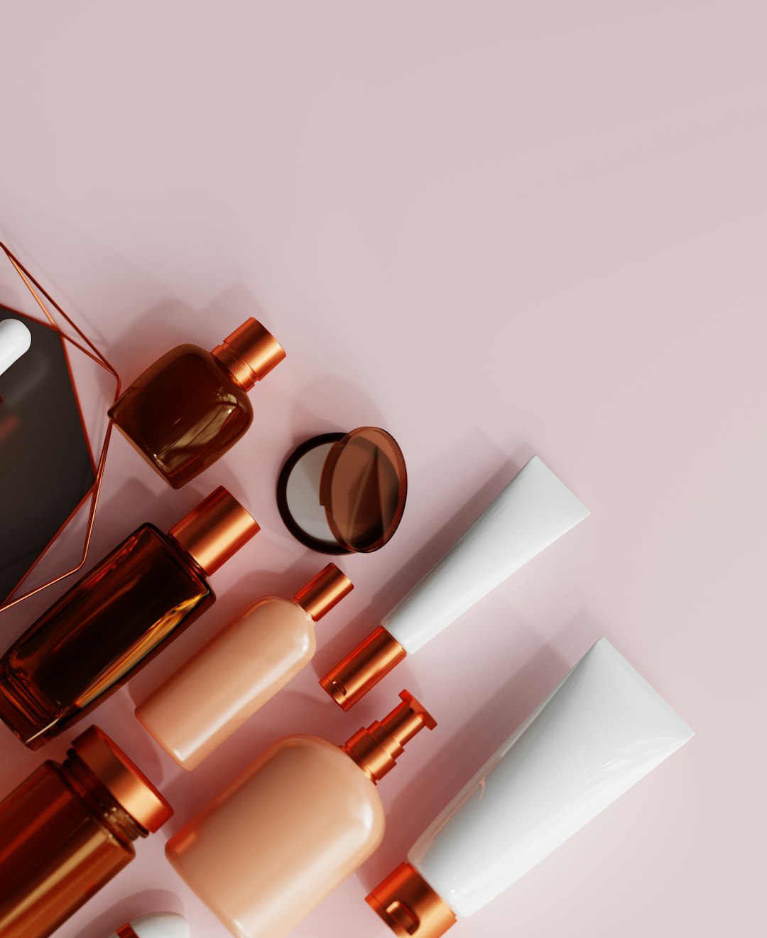 Skincare products in a soft blush editorial setting